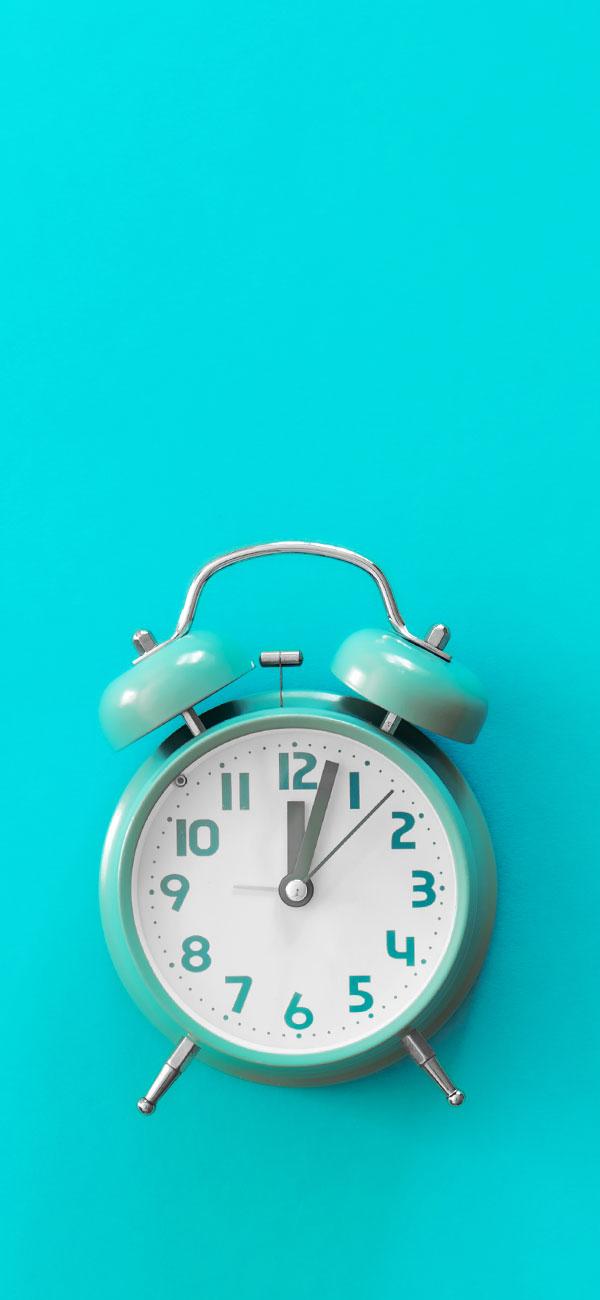 An alarm clock on a blue background