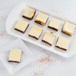 Top view - White tray filled with Cheesecake Brownies.