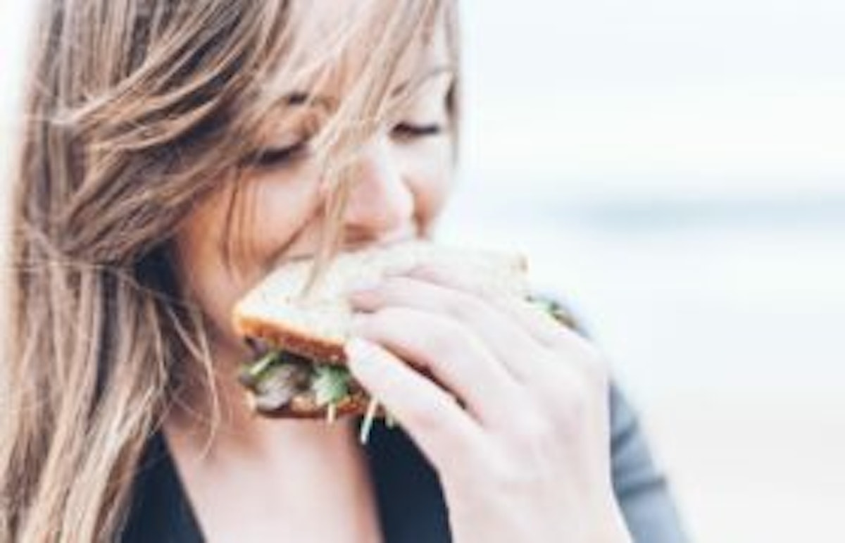 woman eating a sandwich