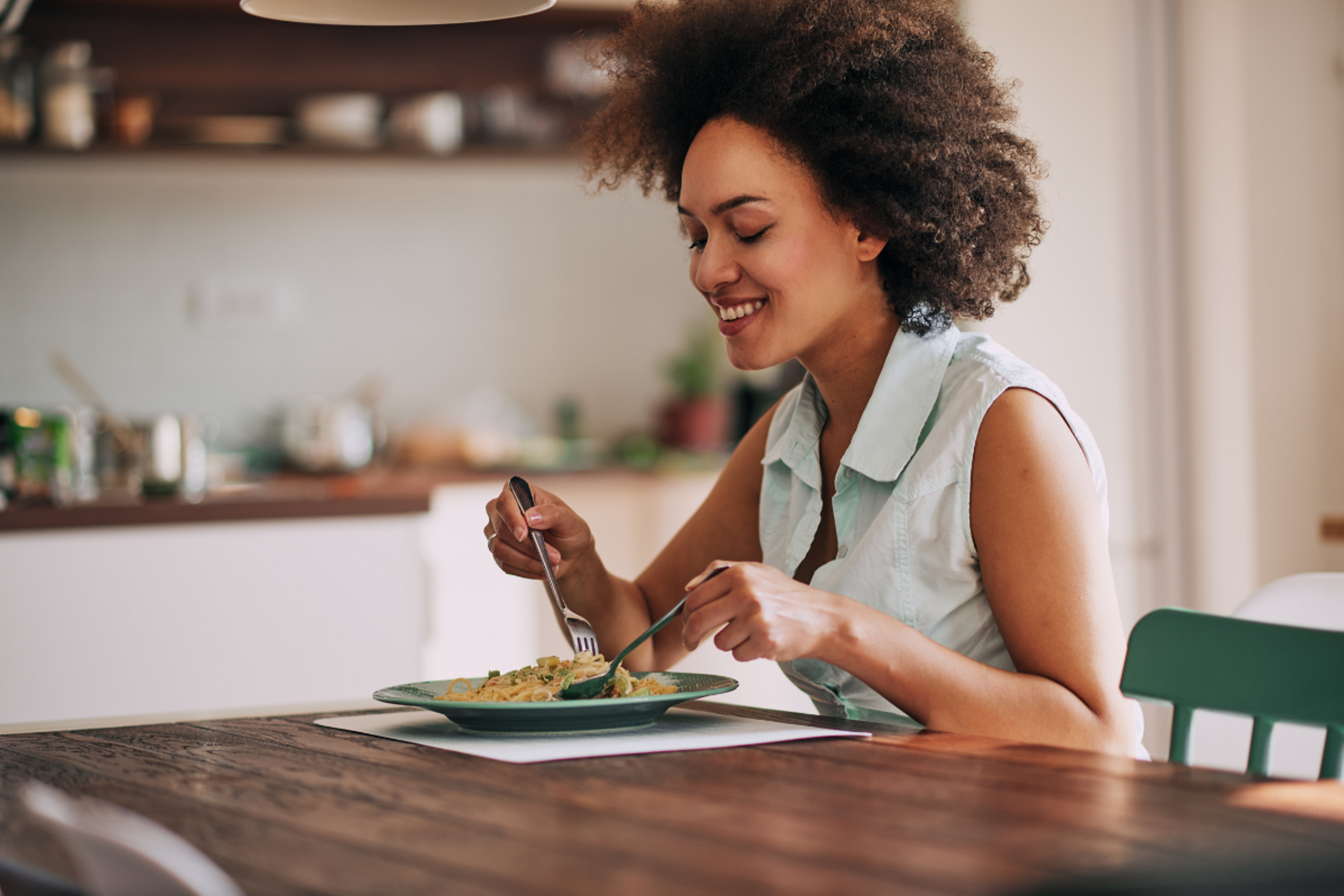 woman eating pasta