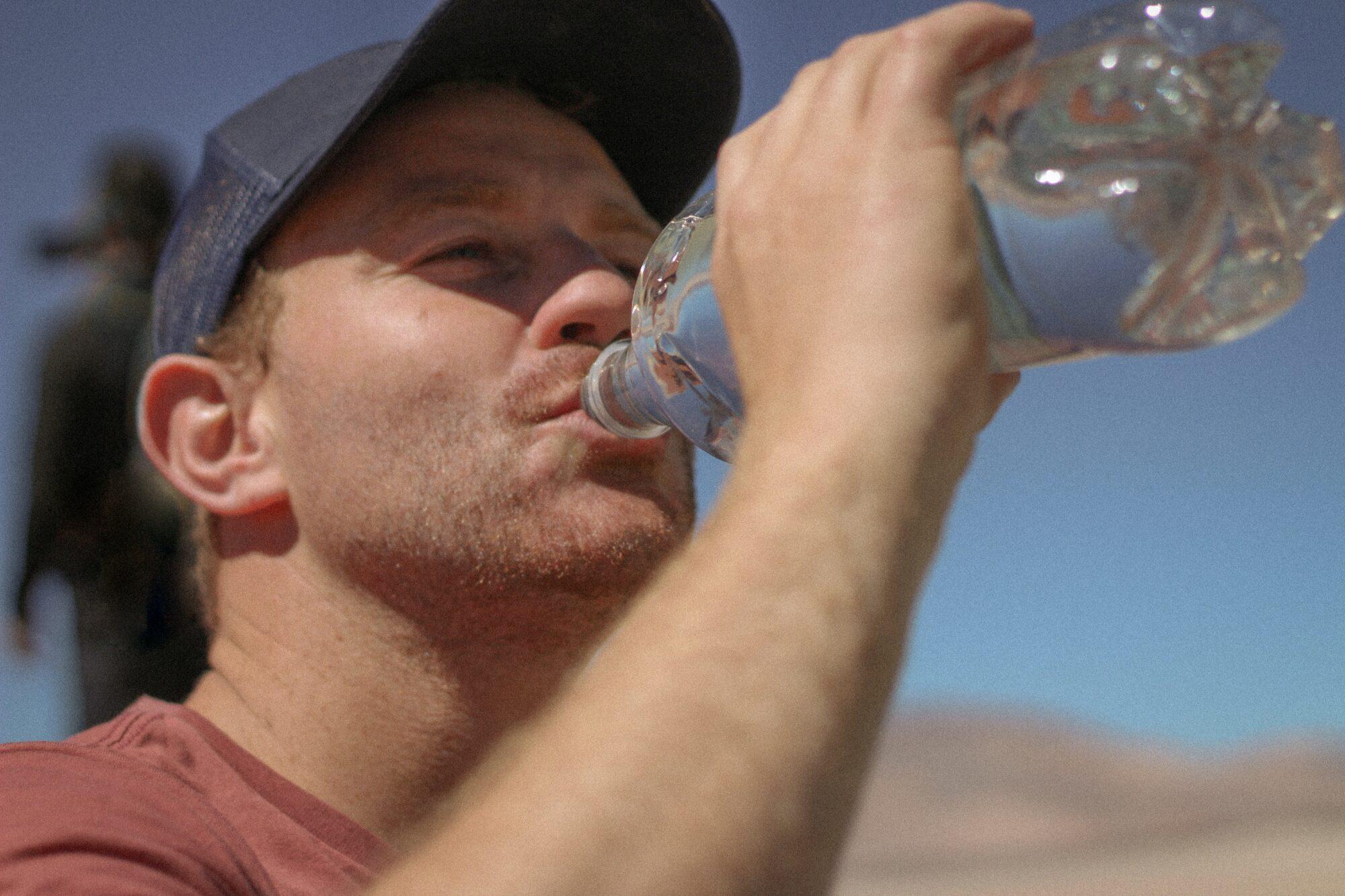 man drinking water