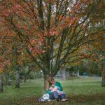 woman breastfeeding in park