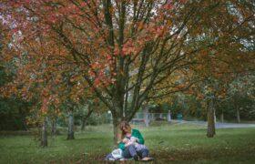 woman breastfeeding in park